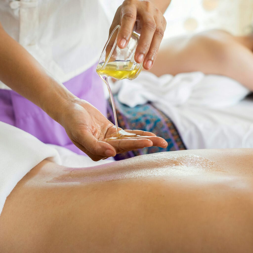 Essential Oils esthetician giving a massage.