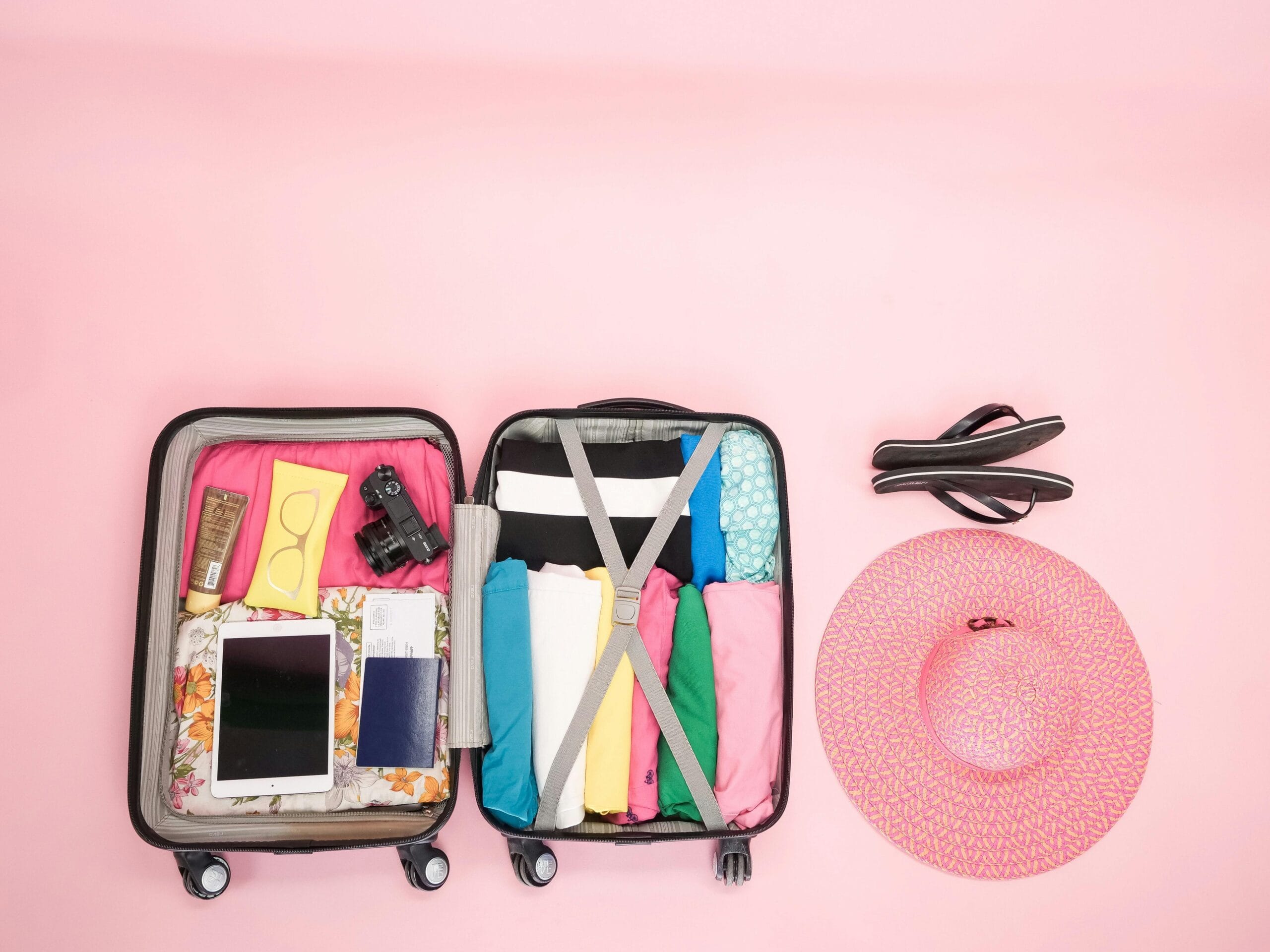 pexels photo 8276910 8276910 Open suitcase packed neatly with clothes and travel essentials, perfect for a summer getaway.
